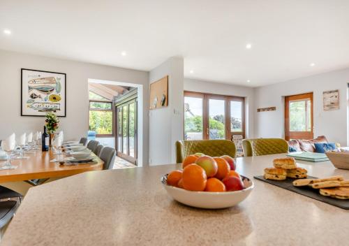 a bowl of fruit on a table in a living room at Cascade in Saundersfoot