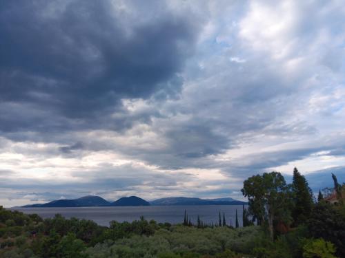 a cloudy sky over a body of water at VKastri in Vasiliki