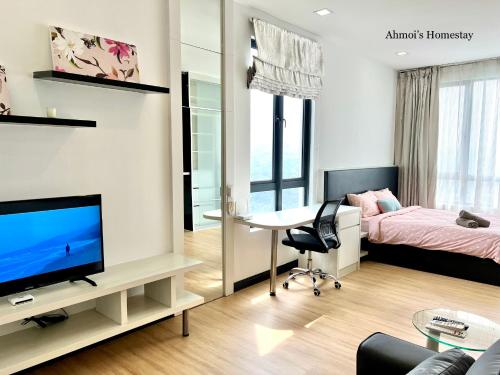 a living room with a tv and a bedroom at MUJI style 2人名宿, Landmark Residence 2, Corner unit, High floor, Free Wi-Fi, Kajang, c180 in Kajang