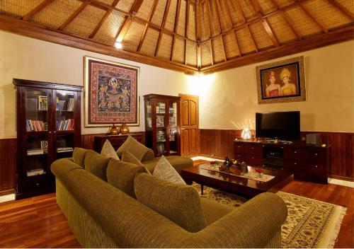 a living room with a couch and a coffee table at Bagus Jati Health & Wellbeing Retreat in Tegalalang