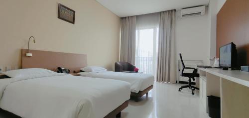Μια τηλεόραση ή/και κέντρο ψυχαγωγίας στο Le Premier Hotel Deltamas