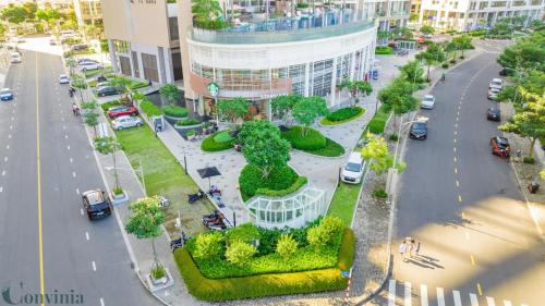 an overhead view of a city street with cars and trees at Lalana Apartment in Ho Chi Minh City