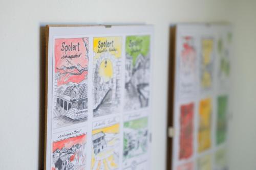 a group of posters hanging on a wall at Agriturismo Spolert Winery in Prepotto