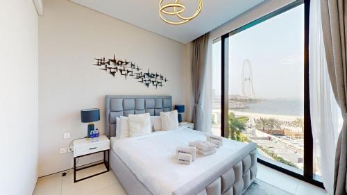 Postel nebo postele na pokoji v ubytování The Address Jumeirah Beach Resort
