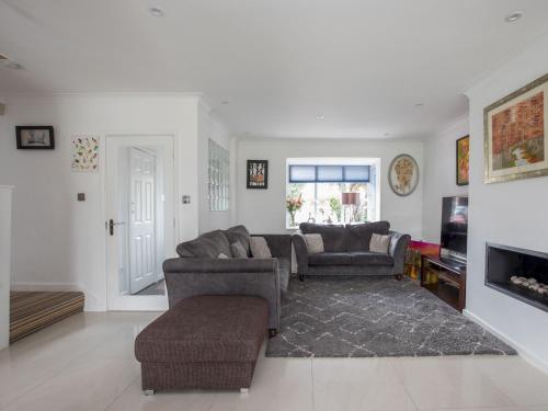 a living room with two couches and a tv at Gorgeous Family Home Near River Thames-Old Windsor - Pass the Keys in Windsor