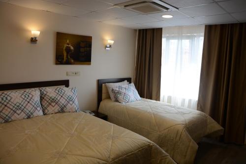En eller flere senge i et værelse på STS Hotel Luleburgaz