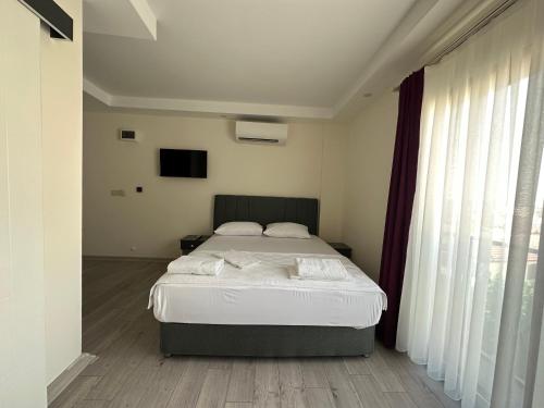 Katil atau katil-katil dalam bilik di Şirin Garden Ayvalık