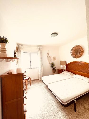 a bedroom with two beds and a window at Ferienwohnung in Vélez-Málaga, Málaga in Málaga