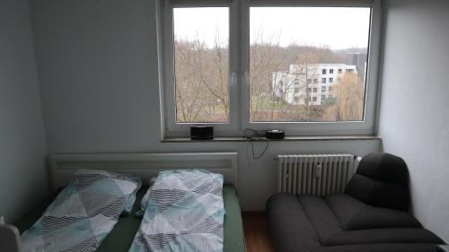 a living room with a couch and a window at 2 Zimmer Wohnung zum Auspowern oder Erholen. in Erkrath