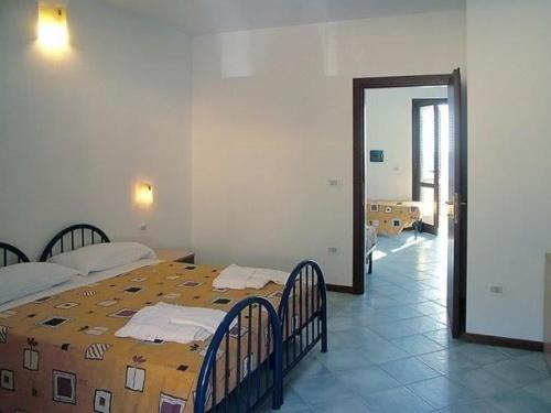Ένα ή περισσότερα κρεβάτια σε δωμάτιο στο Villaggio La Marée