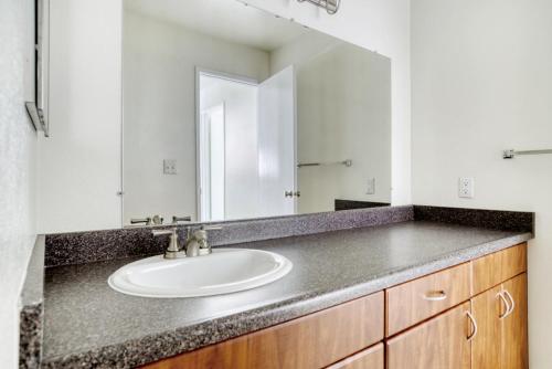 a bathroom with a sink and a mirror at Mountain View 1BR w WD Pool Gym nr groceries SFO-1067 in Mountain View