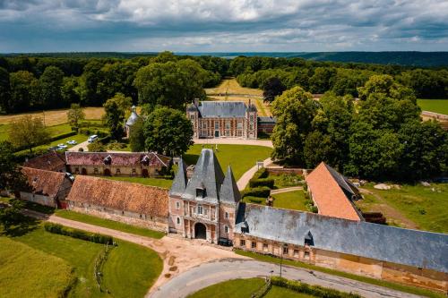 an aerial view of an old building with a yard at Le château de Bonnemare - Bed and breakfast in Radepont