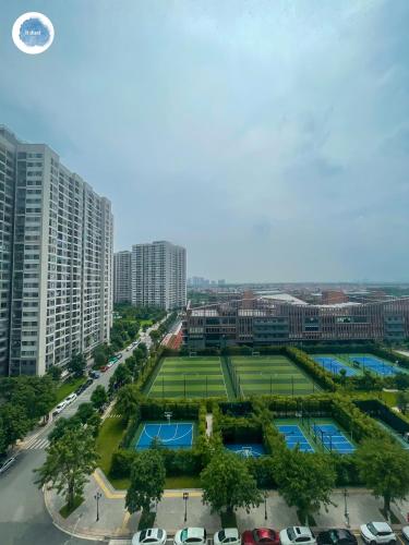 an aerial view of a city with a tennis court at It Dust Homestay 1 - The Ocean Apartment in Hanoi