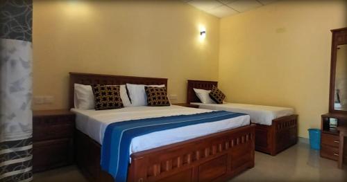 מיטה או מיטות בחדר ב-Sigiri Arana