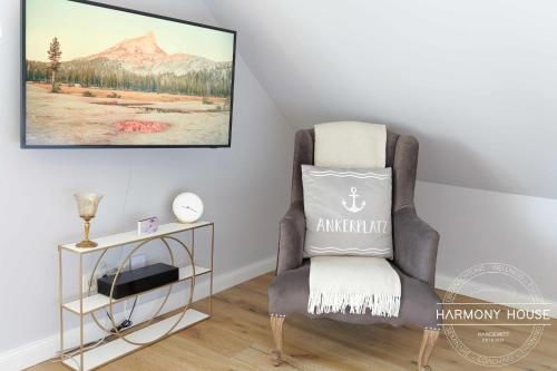 a chair in a room with a pillow on it at Harmony House in Handewitt