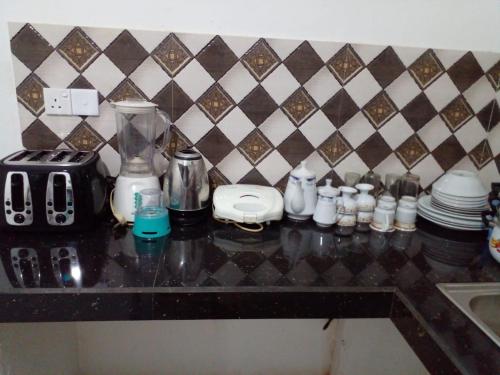 a counter top with a blender and other items on it at Minsara Villa in Hikkaduwa