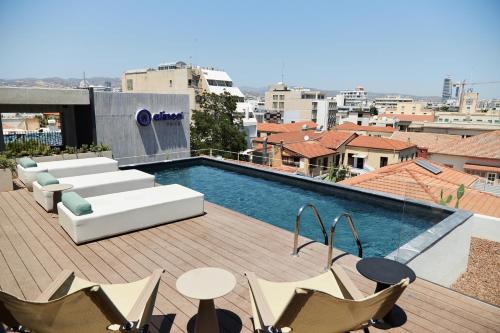 a swimming pool on the roof of a building at Alinea Primo Historic Center in Limassol