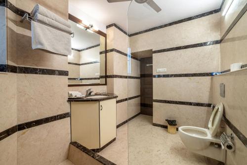 a bathroom with a sink and a toilet at The Almond Tree in Jodhpur
