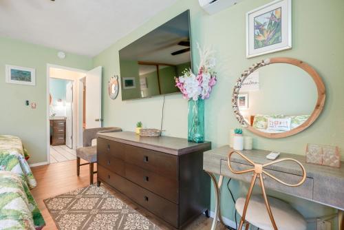a bedroom with a dresser and a mirror in a room at Nani Hale in Kapaa
