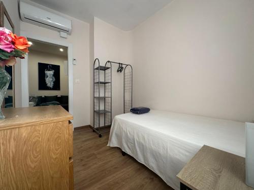 Llit o llits en una habitació de Dos Torres Tenor Gayarre - Encanto con Balcón Interior