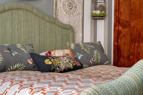 a bedroom with a bed with pillows on it at Apartament Drozdówka Kaszelewskiego 7 APARTZAKOP in Zakopane