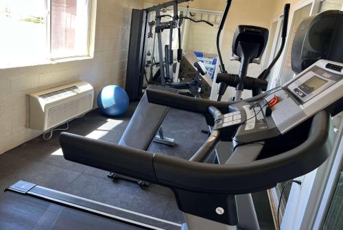 a gym with two tread machines and a treadmill at Travelodge by Wyndham Holbrook in Holbrook