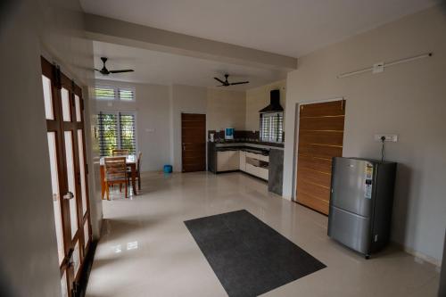 A kitchen or kitchenette at singing greenz staycations