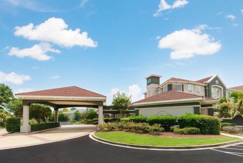 a house with a gazebo on a street at La Quinta by Wyndham Myrtle Beach Broadway Area in Myrtle Beach