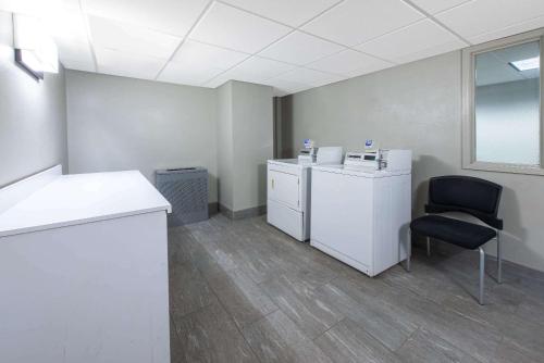 an empty room with a desk and a chair at La Quinta by Wyndham Tampa Brandon Regency Park in Brandon