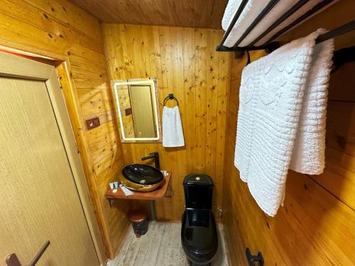 an overhead view of a bathroom in a log cabin at Nika Hotel and Club 