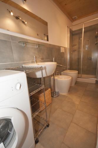 a bathroom with a sink and a toilet at Le Dune in Follonica