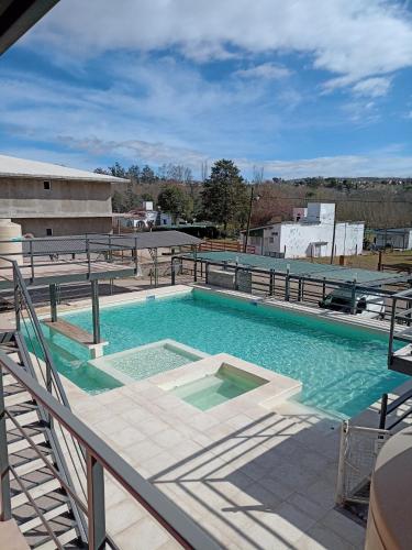 a large swimming pool on top of a building at La posta del vasco in Tanti