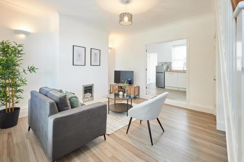 a living room with a couch and a table at Host & Stay - Dove Cottage in Bearpark