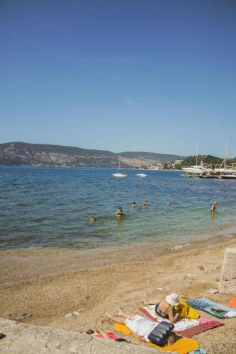 a group of people in the water at a beach at SeaView Zelenika in Herceg-Novi