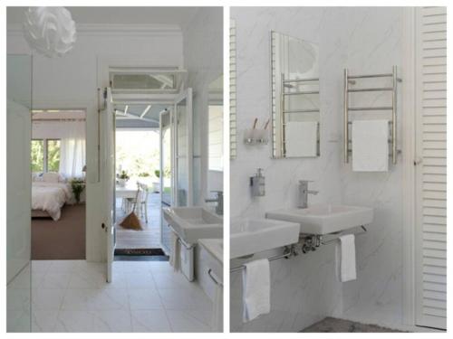 a white bathroom with two sinks and a mirror at Warrane- LUXURY ESTATE WITH POOL & GUESTHOUSE in Long Beach
