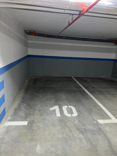 an empty parking lot with the number on it at Apartman EMA in Banja Luka