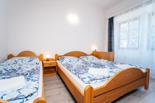 Postel nebo postele na pokoji v ubytování Resort Lesák