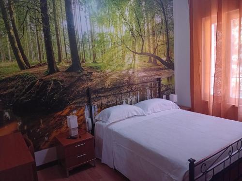 Tempat tidur dalam kamar di Locanda Il Portone