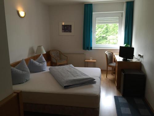 Postel nebo postele na pokoji v ubytování Niebuhrs Hotel