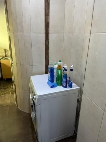 a small refrigerator with bottles on top of it at FAVORIT HOTEL-HOSTEL in Yerevan