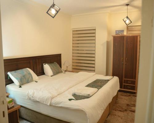 Postel nebo postele na pokoji v ubytování Raqeem Hotel