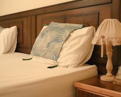 Postel nebo postele na pokoji v ubytování Raqeem Hotel