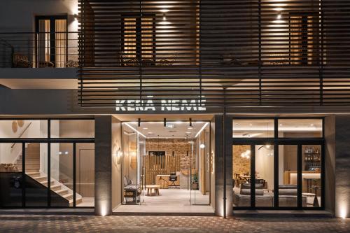 a house with glass doors and a living room at Kera Neme in Neméa