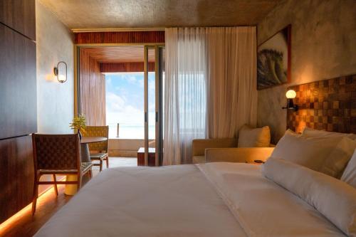 Cama ou camas em um quarto em Duke Beach Hotel Maresias