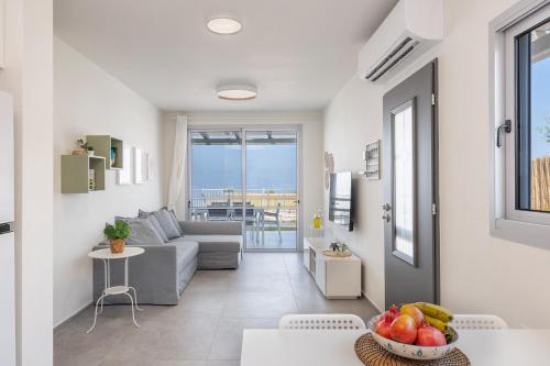 a living room with a couch and a table at RamotKinneret רמות כינרת in Moshav Ramot