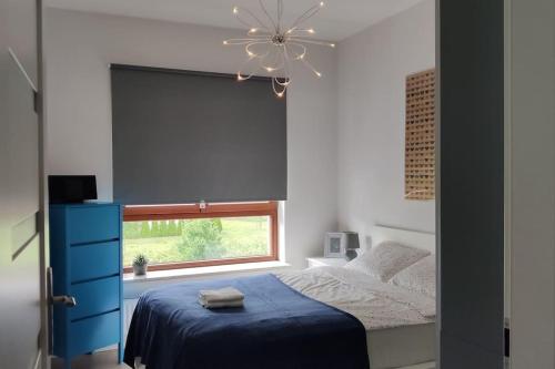 Tempat tidur dalam kamar di Wilanów Comfort, klimatyzacja, garaż, fast WiFi