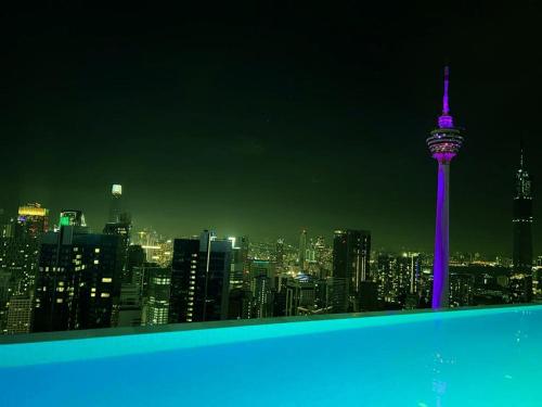 a view of the space needle at night at KLCC Sky Villa Suites Platinum in Kuala Lumpur