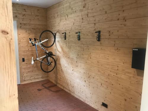 a bike hanging on a wall in a room at FourElements in Wernigerode