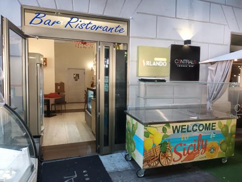 a store entrance with a bar refrigerator and a sign at 55 Aira Hotel in Palermo
