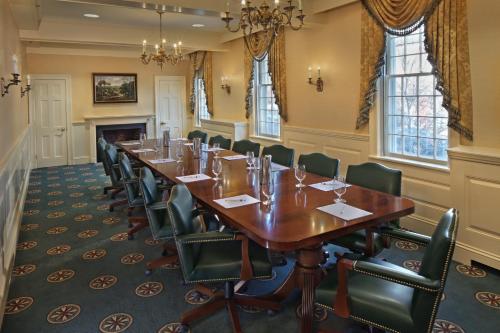 a conference room with a long table and chairs at Inn on Boltwood in Amherst